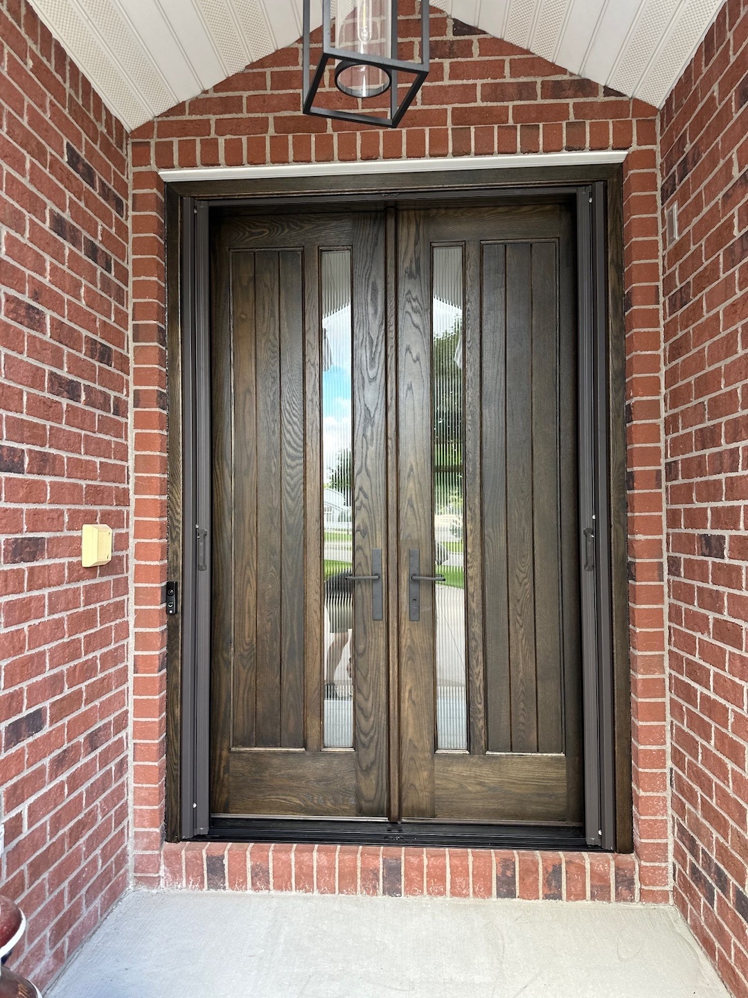 The brand new front door for a home in Kaukauna Wisconsin done by Kindle Windows & Doors.